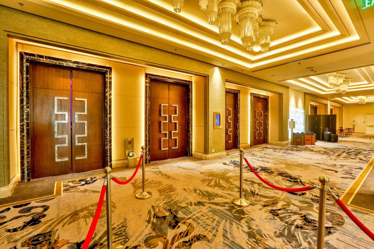 Ballroom foyer at Sheraton Manila: chandeliers and the ballroom entrance doors